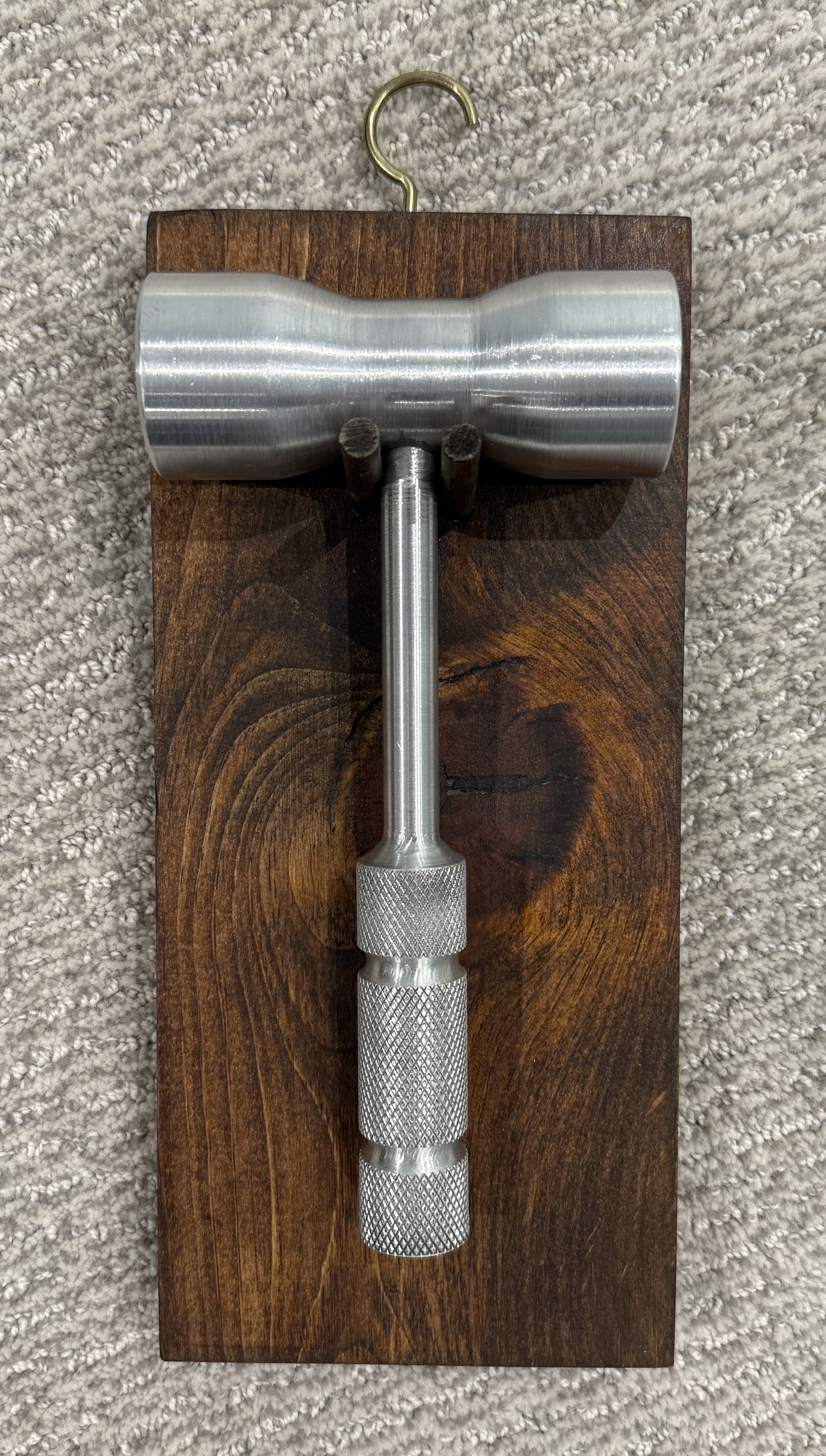 Aluminum mallet with stained pine display stand